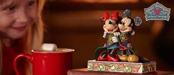 Retired Disney Traditions figurines including Evil Queen, Jack & Sally, and classic princess scenes