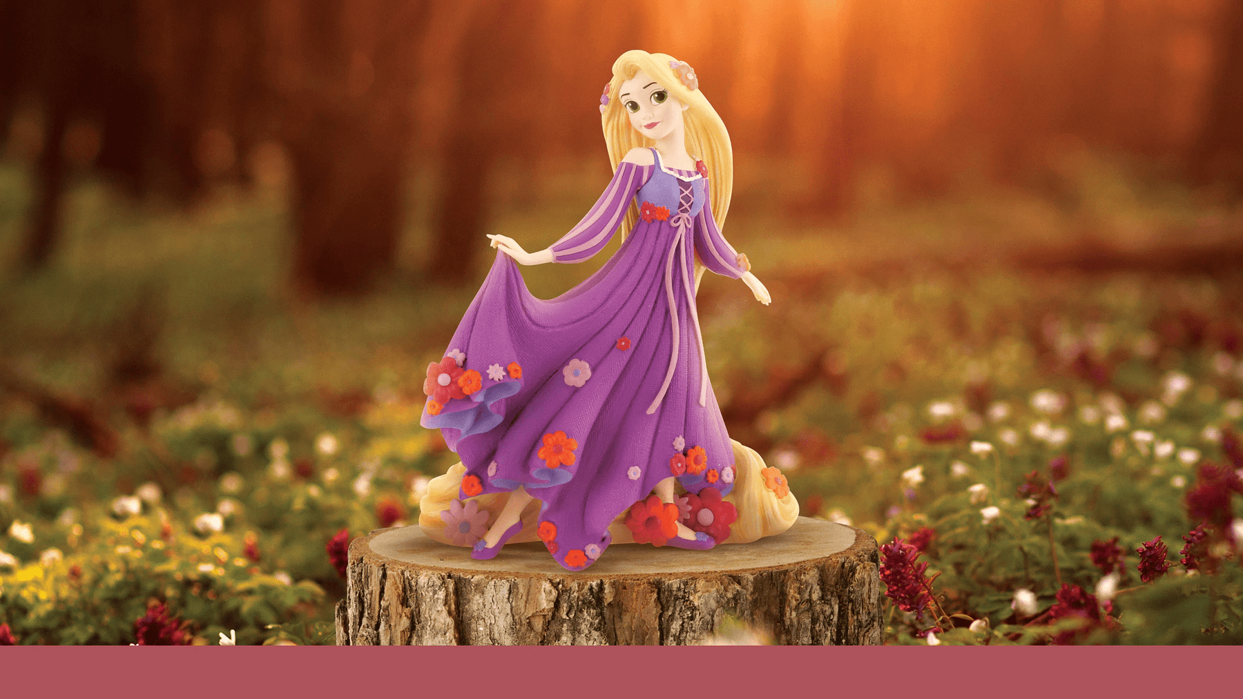 Disney Princess collectible figurines featuring Belle, Ariel, Rapunzel, and Cinderella in a display