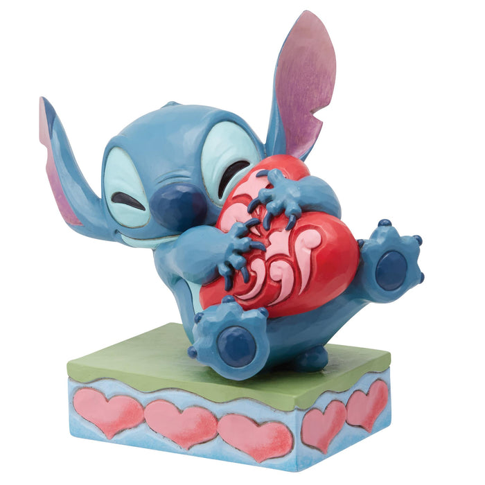 Stitch umarmt eine Herzfigur