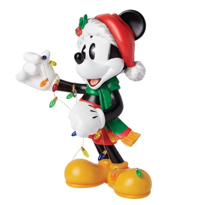 Side view of the Christmas Mickey Mouse Big Figurine – Disney Showcase by Enesco, showcasing intricate sculpting and holiday-themed details.