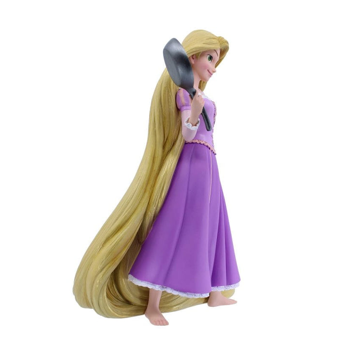 Side view of the Rapunzel Figurine – Disney Showcase by Enesco, showcasing intricate sculpting and golden detailing.