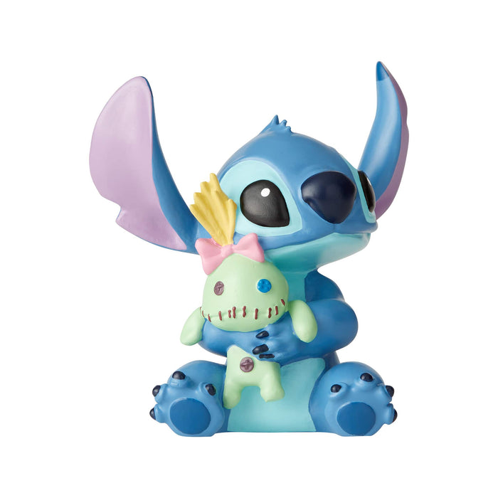Stitch Doll Figurine – Disney Showcase by Enesco, hand-painted collectible featuring Stitch hugging his favorite doll, Scrump.