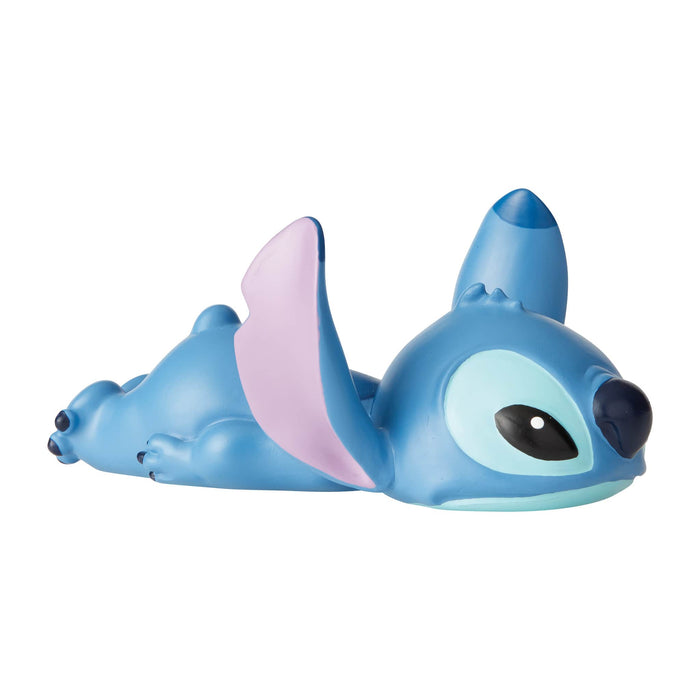 Stitch Laying Down Figurine – Disney Showcase by Enesco, hand-painted collectible featuring Stitch in a relaxed, playful pose.