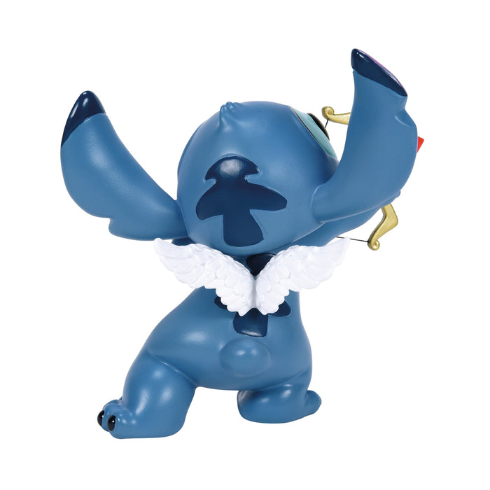 Back view of the Stitch Valentine’s Moment Figurine – Disney Showcase by Enesco, featuring Stitch’s adorable pose and soft pastel colors.