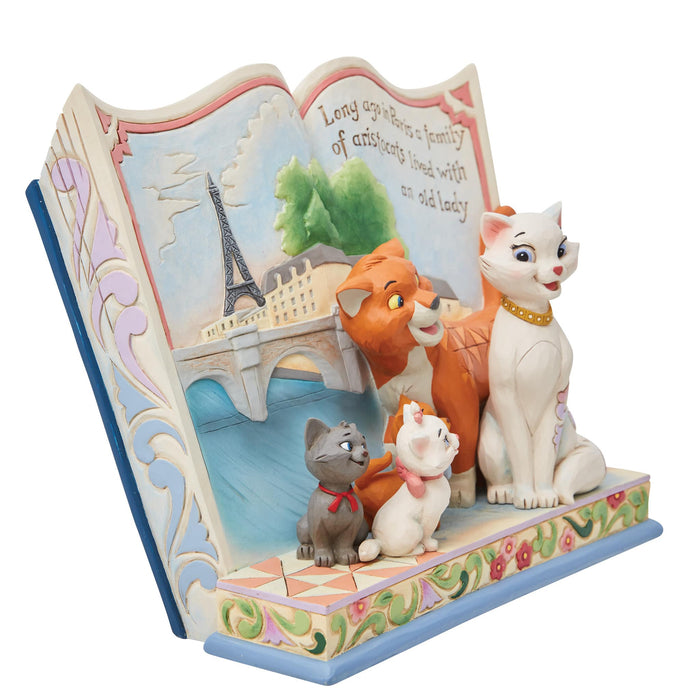 Side view of Aristocats Storybook Figurine – Enesco Disney Traditions by Jim Shore, featuring intricate folk-art details.