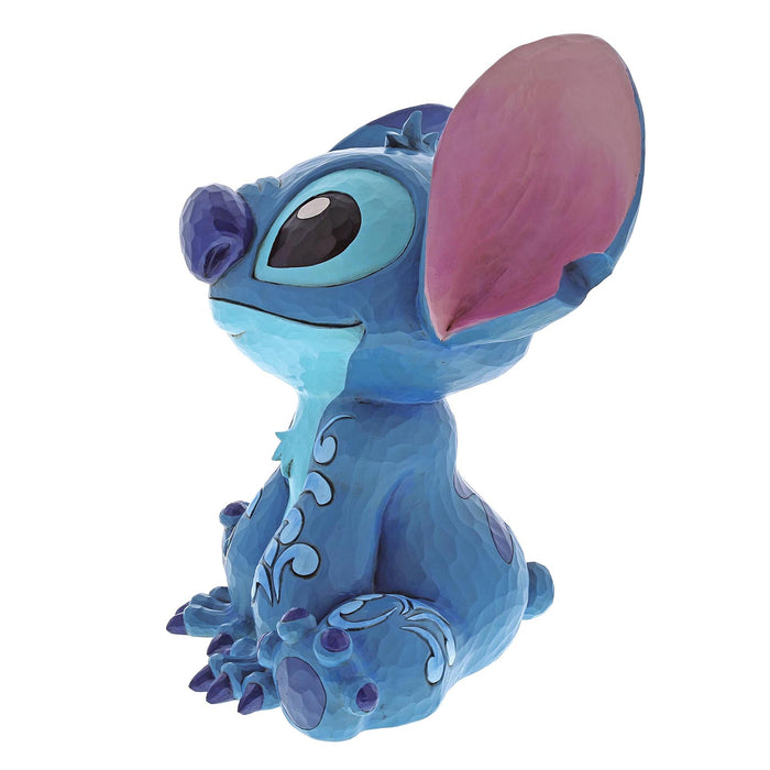 Side view of Big Trouble (Stitch Statement Figurine) – Enesco Disney Traditions by Jim Shore, showcasing detailed sculpting and folk-art accents.