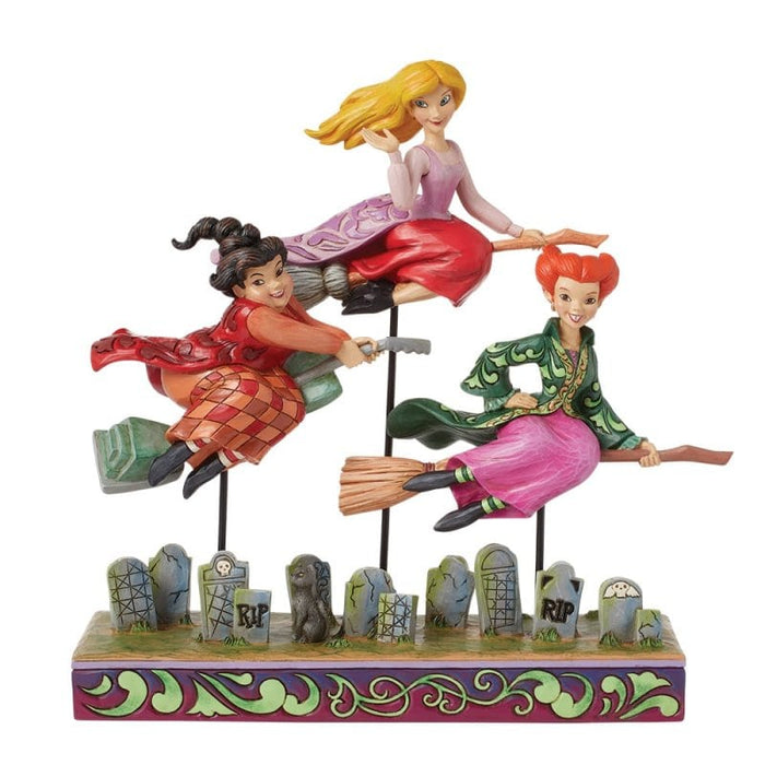 Come We Fly (Sanderson Sisters Figurine) – Enesco Disney Traditions by Jim Shore, hand-painted collectible featuring Winifred, Sarah, and Mary Sanderson on broomsticks.