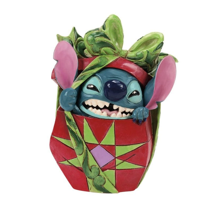 Holiday Mischief (Stitch Tearing Christmas Present Figurine) – Enesco Disney Traditions by Jim Shore, hand-painted collectible featuring Stitch opening a Christmas gift.