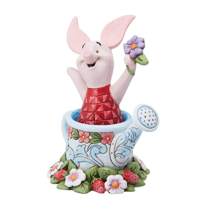 Side view of Piglet in a Watering Can Figurine – Enesco Disney Traditions by Jim Shore, featuring folk-art floral details.