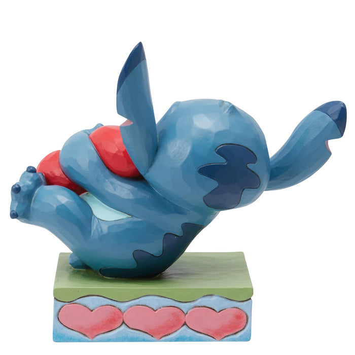 Back view of Stitch Hugging a Heart Figurine – Jim Shore hand-painted Disney collectible from Lilo & Stitch.