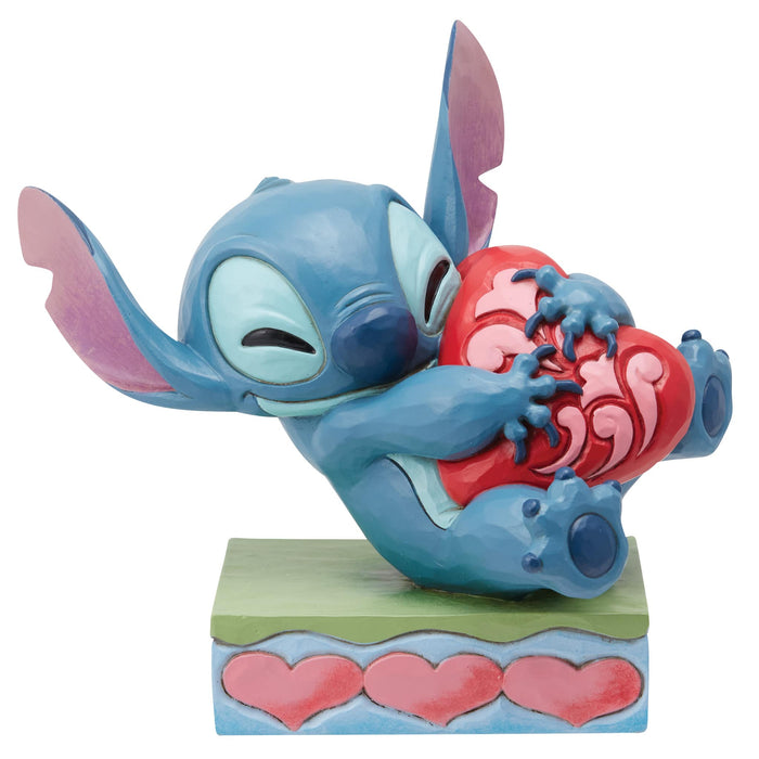 Stitch Hugging a Heart Figurine – Enesco Disney Traditions by Jim Shore, hand-painted collectible from Lilo & Stitch.
