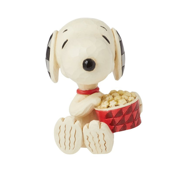 Snoopy Popcorn Mini Figurine – Peanuts by Jim Shore, hand-painted collectible with Snoopy holding popcorn in folk art style.