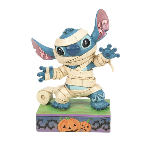 Mummy Stitch Figurine – Enesco Disney Traditions by Jim Shore, hand-painted Halloween collectible featuring Stitch wrapped in mummy bandages.
